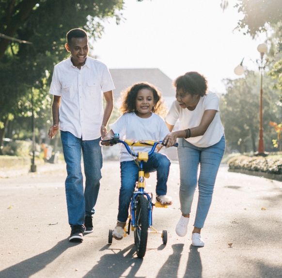 two-parents-with-daughter-on-bike.jpg
